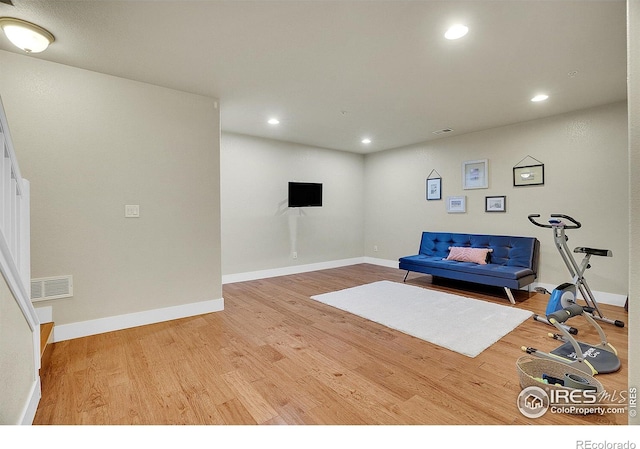 exercise area featuring light hardwood / wood-style flooring