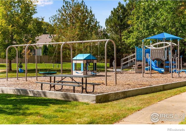 view of jungle gym with a lawn