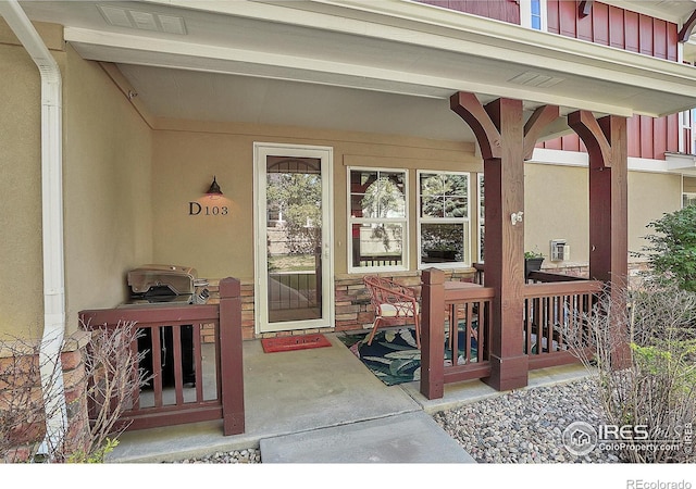 doorway to property featuring a porch