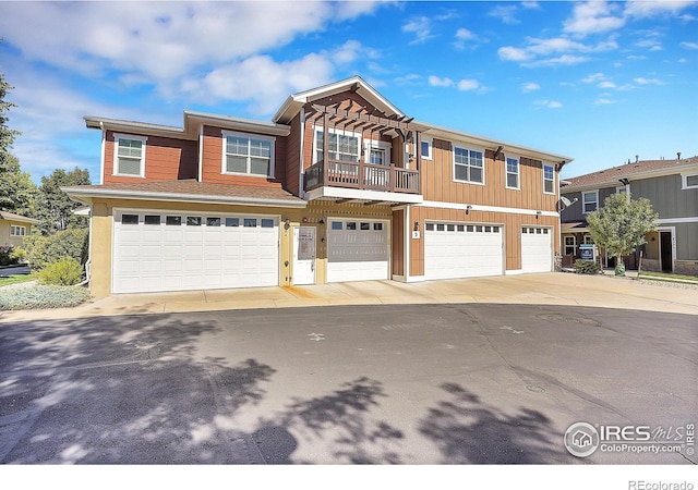 view of front of house with a balcony and a garage