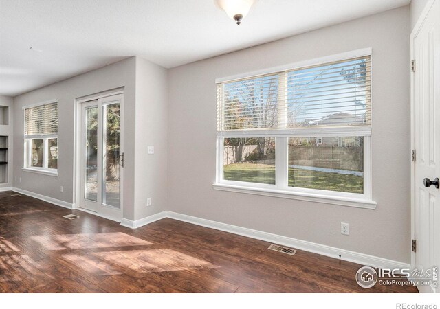 empty room featuring dark hardwood / wood-style floors