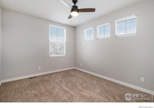 carpeted empty room with ceiling fan