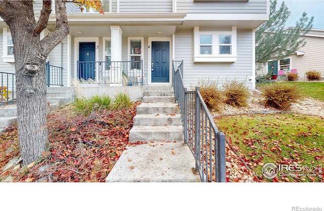 doorway to property with covered porch