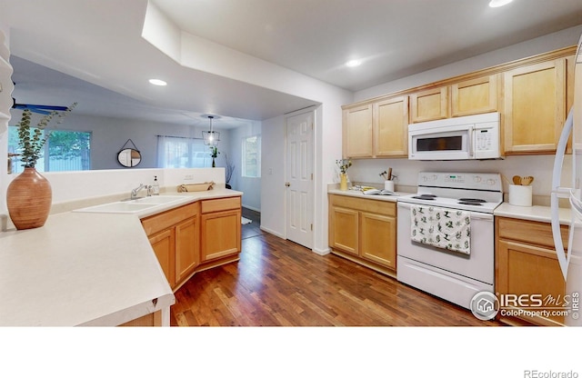 kitchen featuring light brown cabinets, sink, dark hardwood / wood-style floors, decorative light fixtures, and white appliances