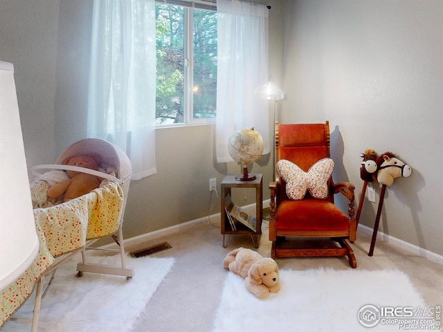 living area featuring carpet flooring