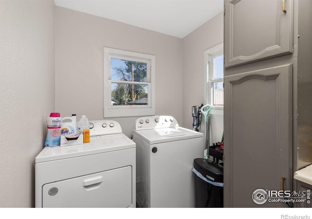 washroom with independent washer and dryer