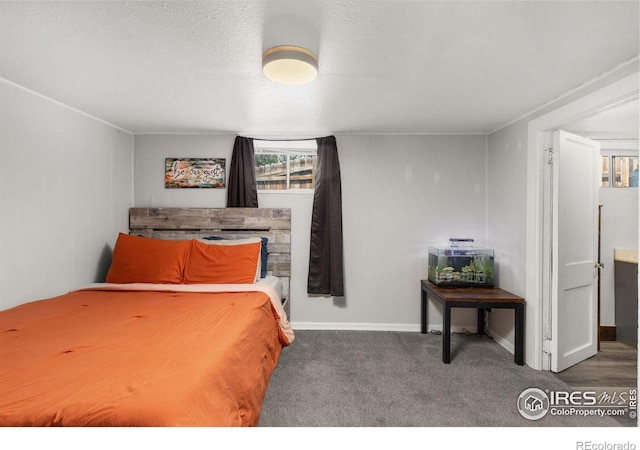 carpeted bedroom with a textured ceiling