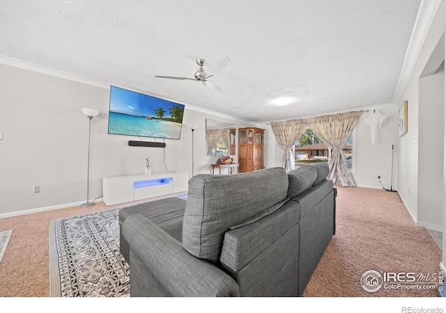 living room featuring carpet floors, ceiling fan, and ornamental molding