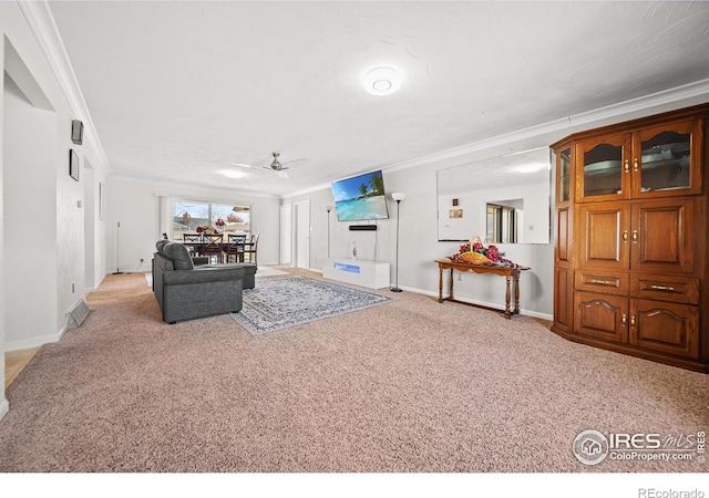 living room with ceiling fan, light colored carpet, and crown molding