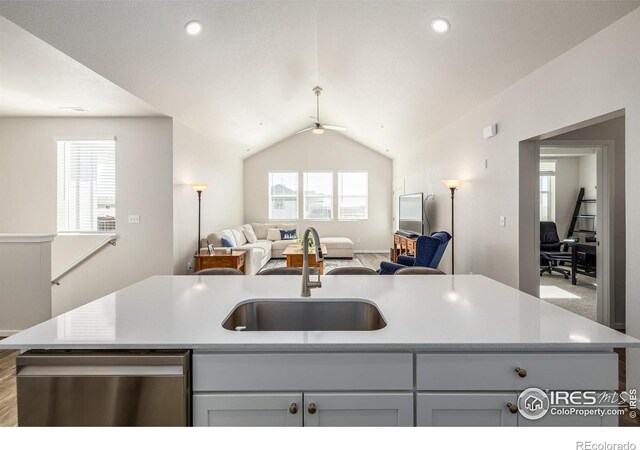 1820 Iron Wheel Dr Unit 3, Windsor, CO 80550 - kitchen with stainless steel dishwasher, open floor plan, ceiling fan, light countertops, and lofted ceiling