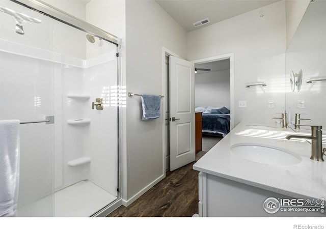 1820 Iron Wheel Dr Unit 3, Windsor, CO 80550 - full bath with wood finished floors, double vanity, a stall shower, and ensuite bath