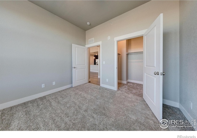 unfurnished bedroom featuring a closet and carpet