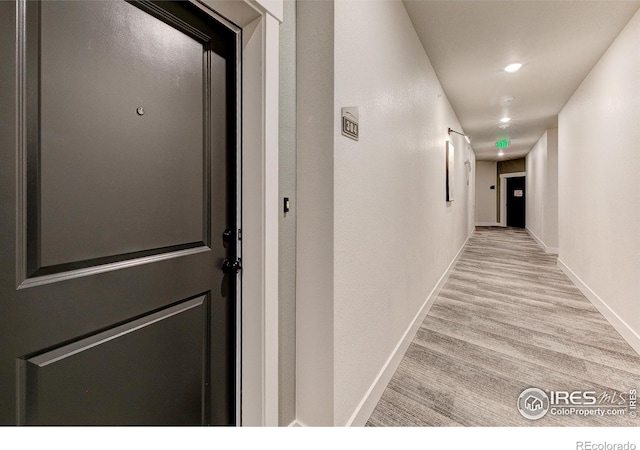 corridor featuring light hardwood / wood-style flooring