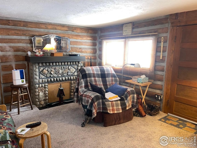 interior space with wood walls, carpet floors, and a textured ceiling