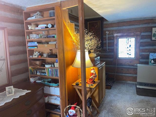 interior space with carpet floors and heating unit