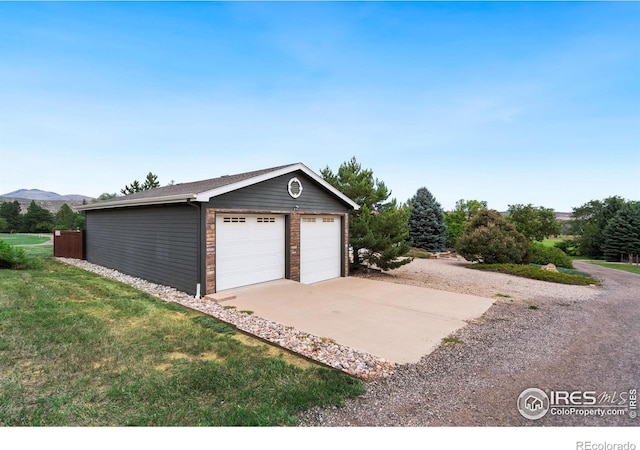 detached garage featuring a mountain view