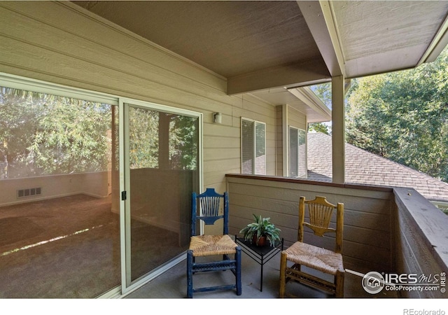 view of patio / terrace featuring a balcony and visible vents