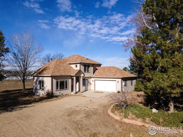 view of front of property with a garage