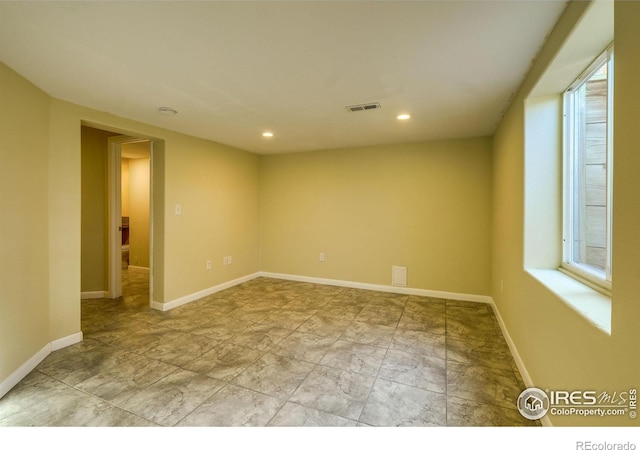 spare room with a wealth of natural light