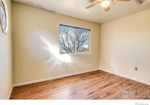 spare room featuring light wood-type flooring and ceiling fan