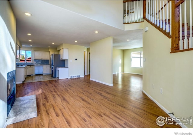 unfurnished living room with light hardwood / wood-style floors