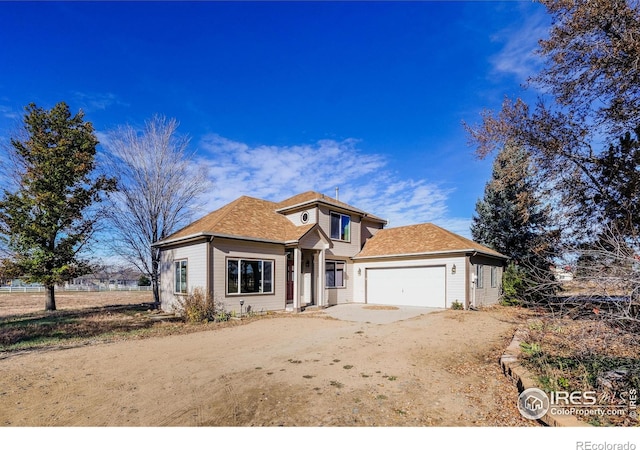 front of property with a garage