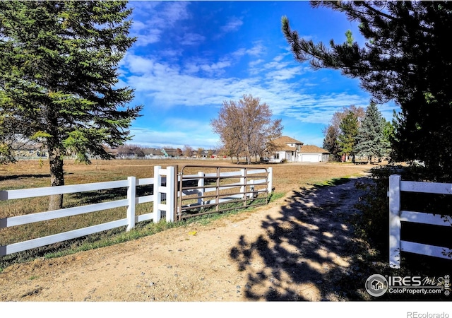 view of yard with a rural view