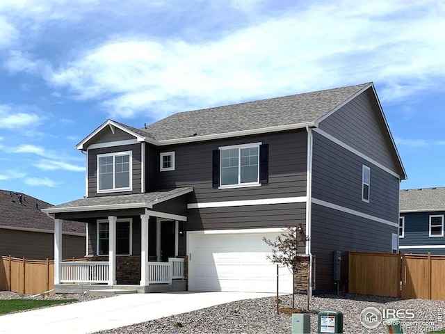 craftsman inspired home featuring covered porch and a garage