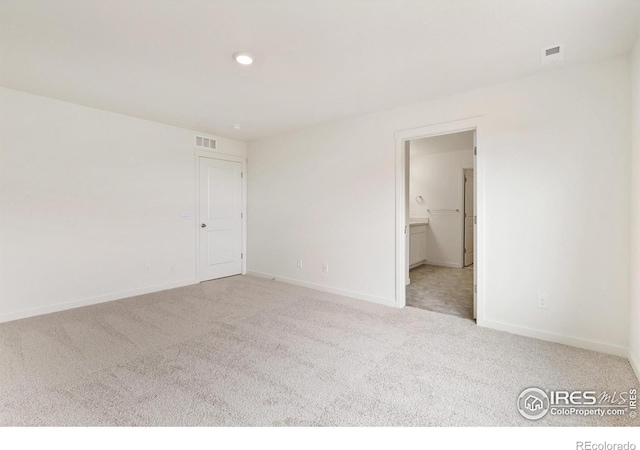 view of carpeted spare room