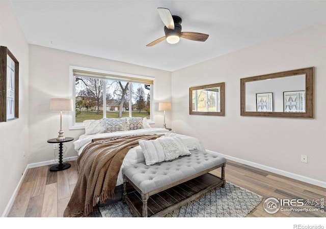 bedroom featuring hardwood / wood-style flooring and ceiling fan