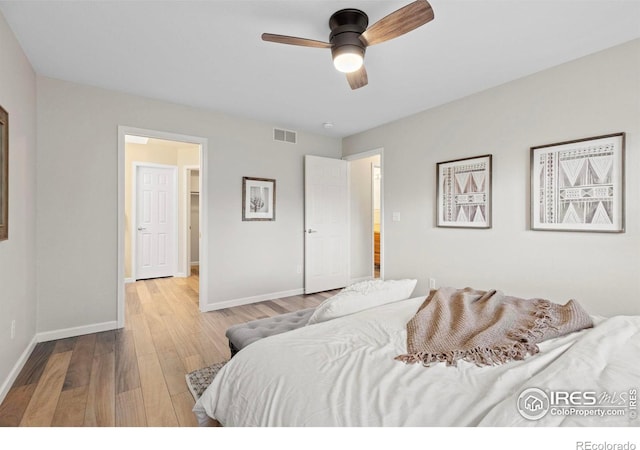 bedroom with light wood-type flooring and ceiling fan