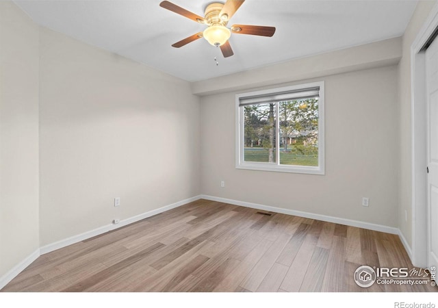 unfurnished room featuring light wood-type flooring and ceiling fan