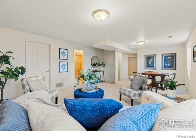 living room with light colored carpet