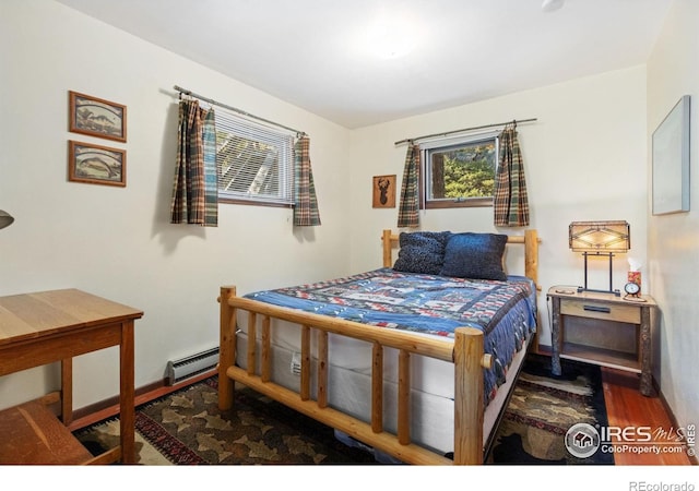 bedroom with hardwood / wood-style flooring