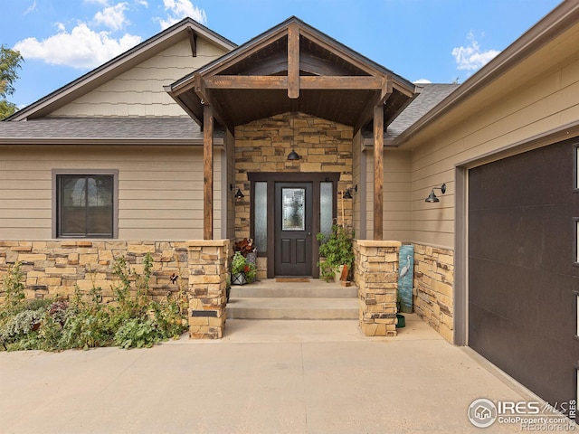 entrance to property featuring a garage