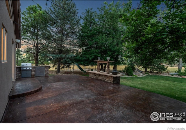 view of patio / terrace featuring exterior kitchen and grilling area