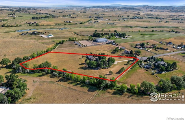 aerial view featuring a mountain view and a rural view