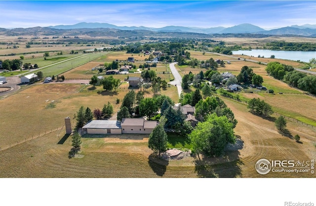 drone / aerial view with a rural view and a water and mountain view