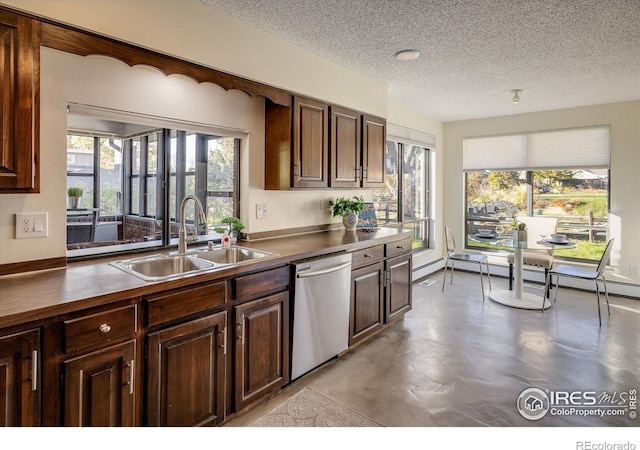 kitchen with dishwasher, dark brown cabinets, a textured ceiling, and sink