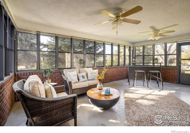 sunroom / solarium with ceiling fan