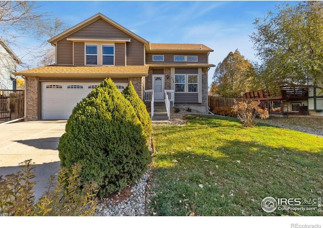 view of front of home with a front yard and a garage