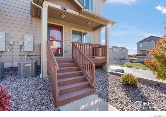 entrance to property featuring central AC unit