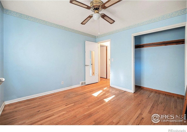 unfurnished bedroom featuring a closet, ceiling fan, and light hardwood / wood-style flooring