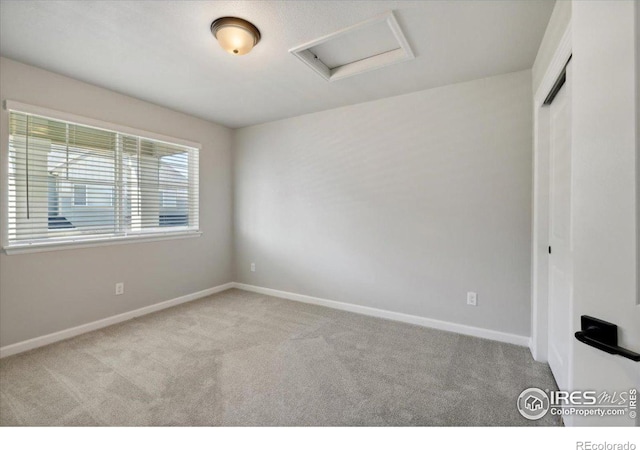 unfurnished room with light colored carpet