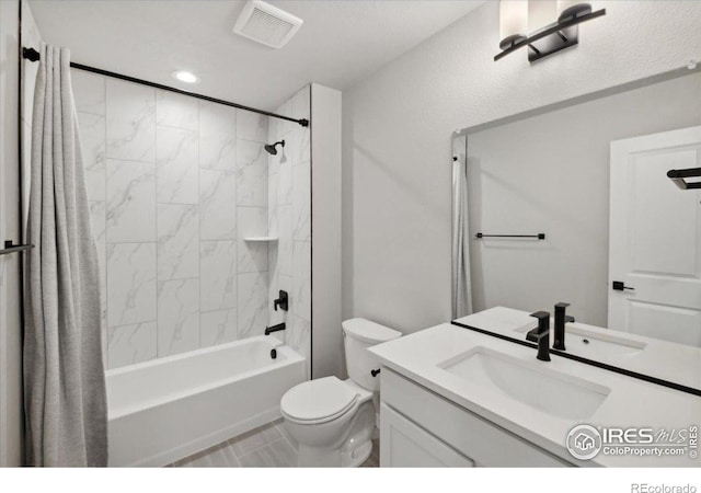 full bathroom with tile patterned floors, vanity, toilet, and tiled shower / bath