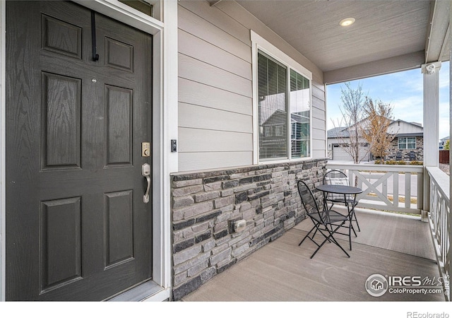 property entrance featuring covered porch