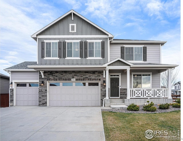 craftsman-style house featuring a front yard and a garage