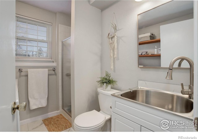 bathroom featuring walk in shower, vanity, and toilet