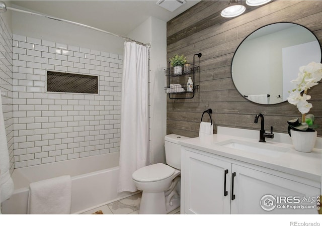 full bathroom featuring shower / bath combination with curtain, vanity, toilet, and wooden walls