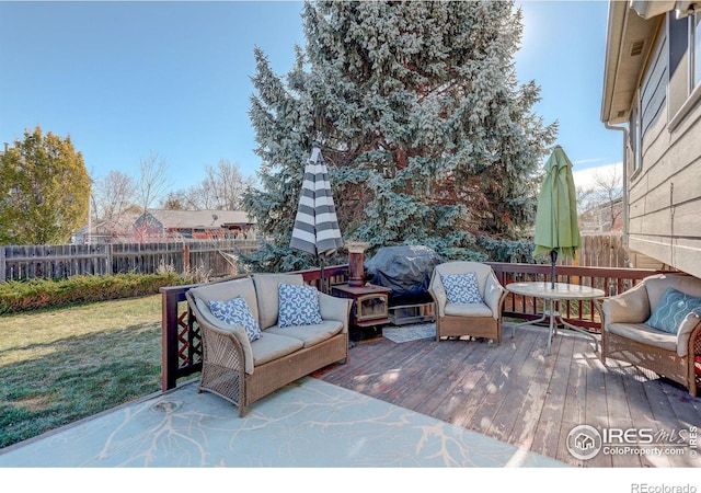 view of patio featuring area for grilling and a wooden deck